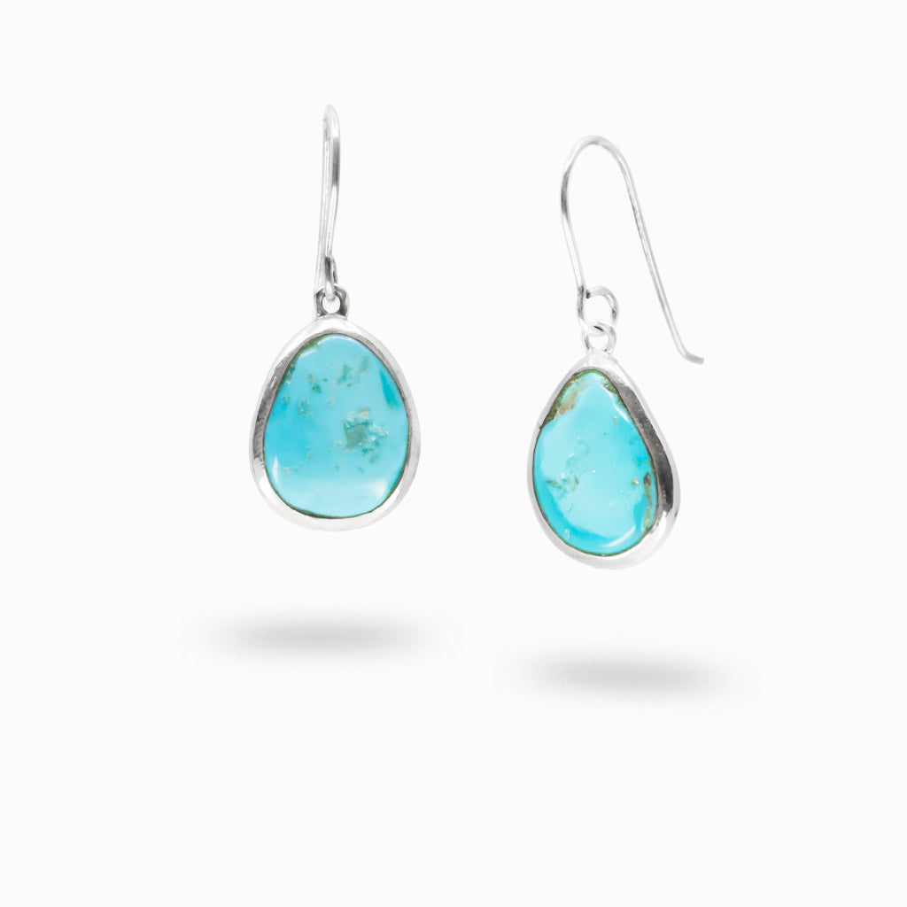 Sleeping Beauty Turquoise polished freeform drop earrings set in sterling silver with French hooks.