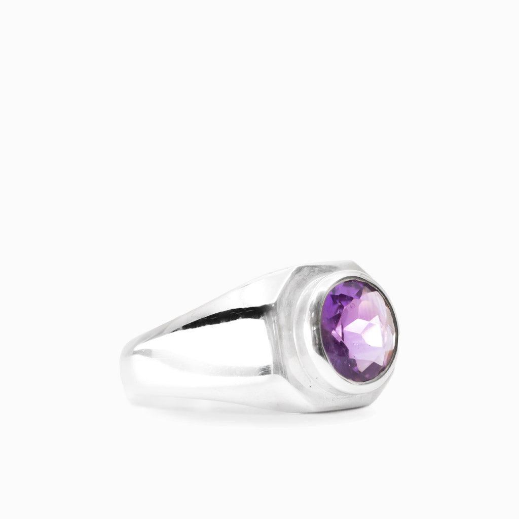 Round faceted purple Amethyst gemstone bezel set in a polished 925 sterling silver ring.