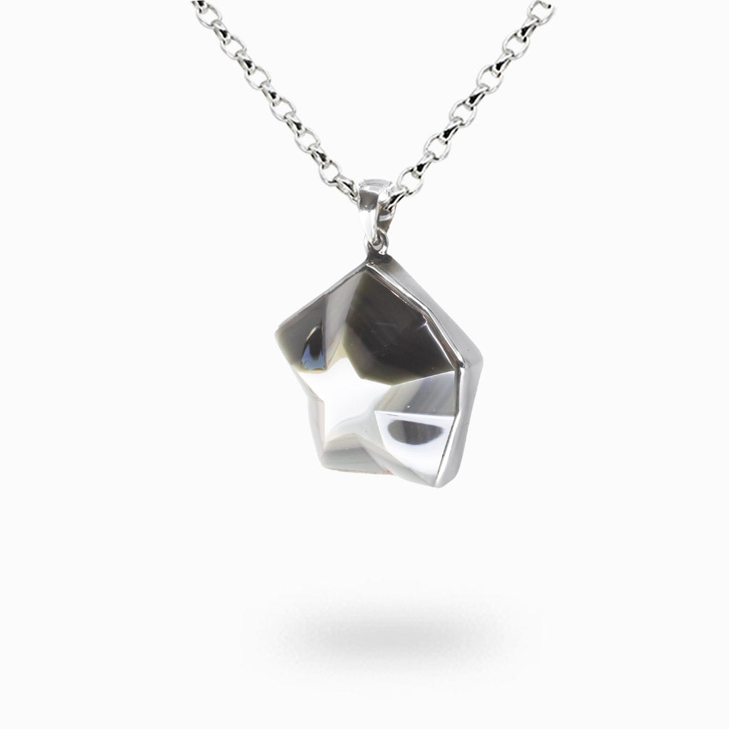 Star-shaped rainbow obsidian cabochon necklace in sterling silver bezel with iridescent volcanic glass and natural multicolor sheen. | MADE IN EARTH