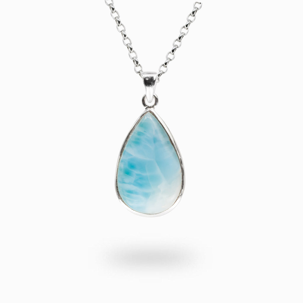 Pear-shaped Larimar gemstone pendant with natural blue and white marbling handcrafted in sterling silver.
