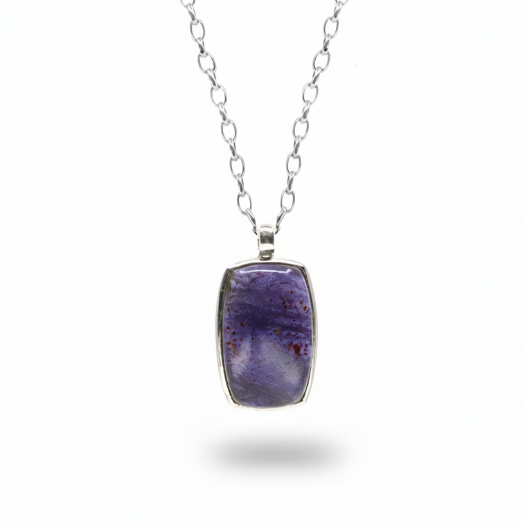 Rectangular iolite cabochon pendant with soft purple tones in sterling silver necklace