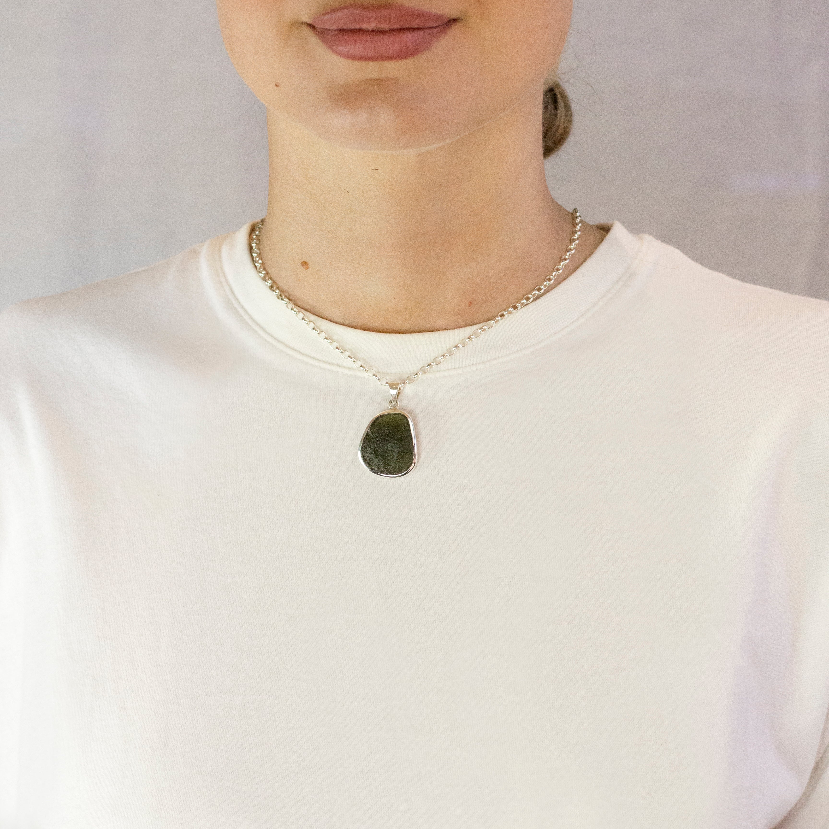 Model Wearing Light forest green translucent Moldavite Necklace
