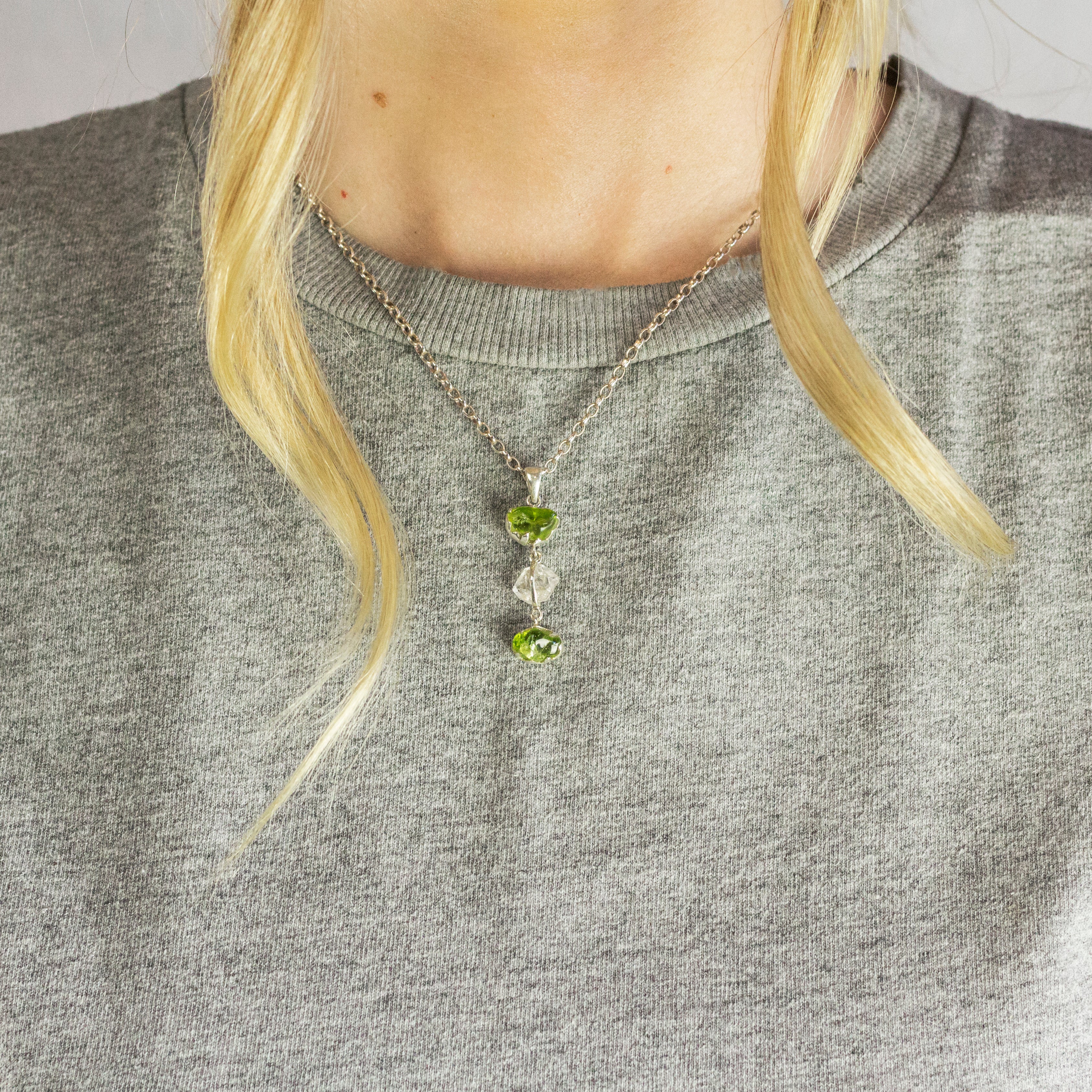 Model Wearing Natural raw Green Peridot stones and Herkimer Diamond crystal Necklace