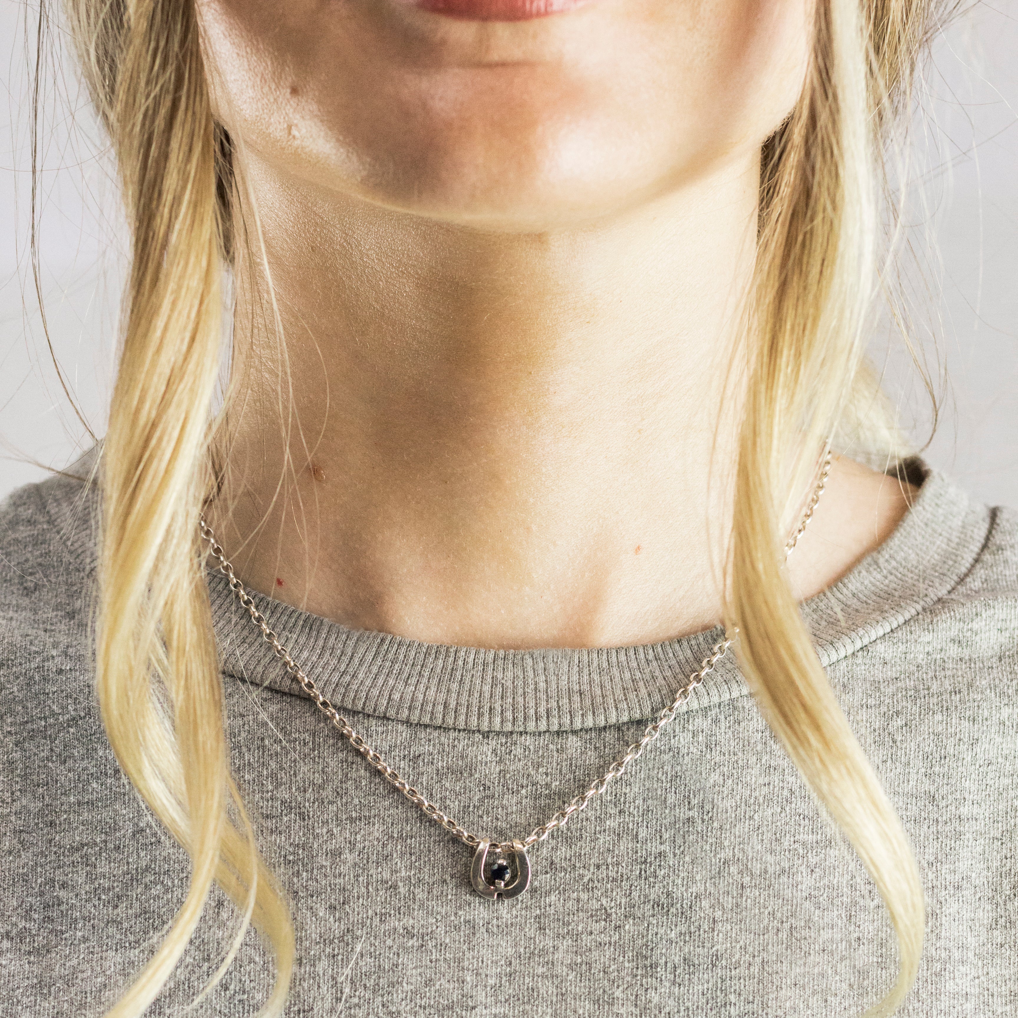 Sterling Silver Horseshoe Faceted Sapphire Necklace On Model
