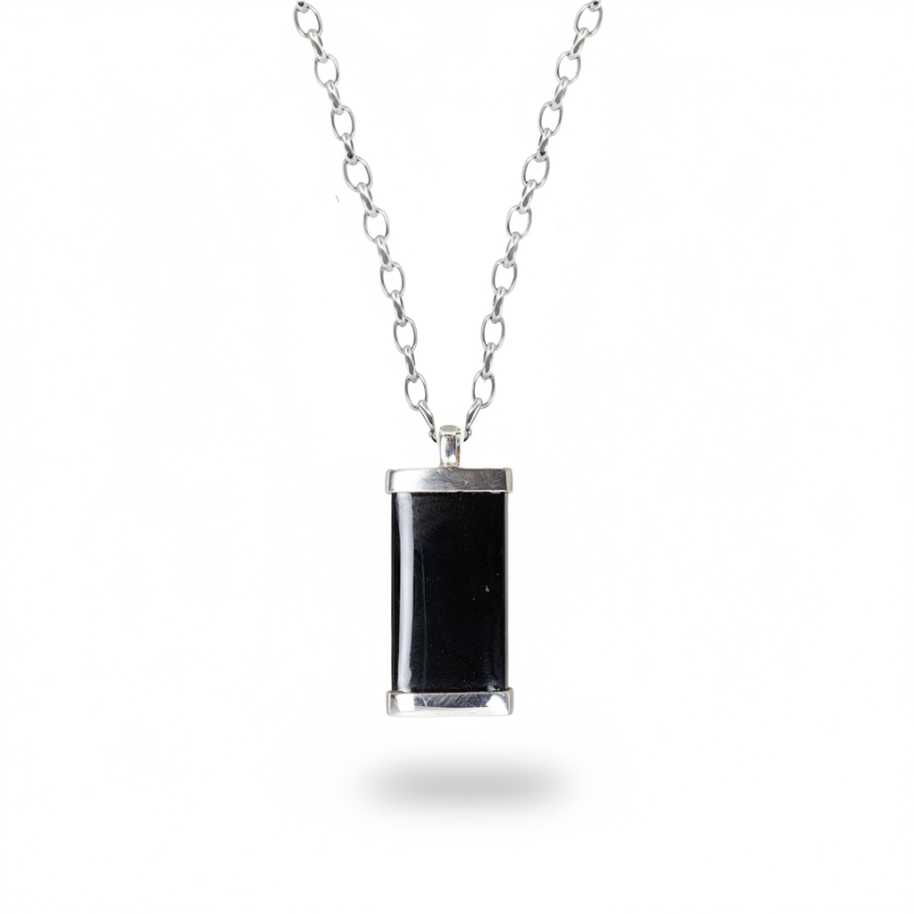 Rectangular black onyx pendant with polished surface in sterling silver necklace