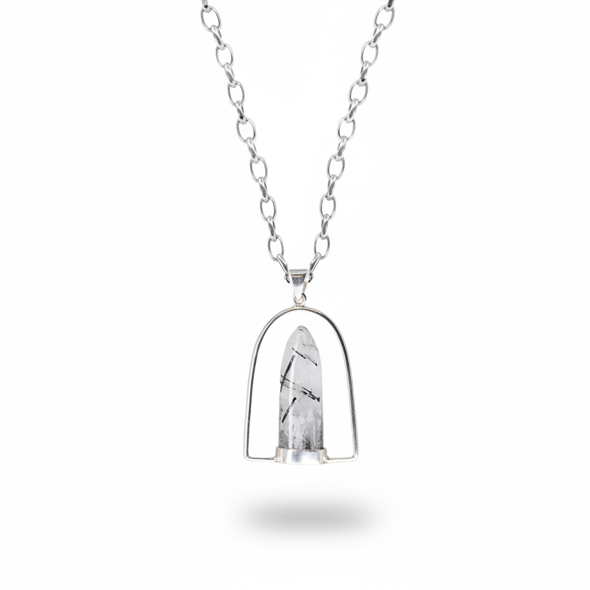 Tourmalinated quartz bullet pendant with black inclusions in halo sterling silver setting