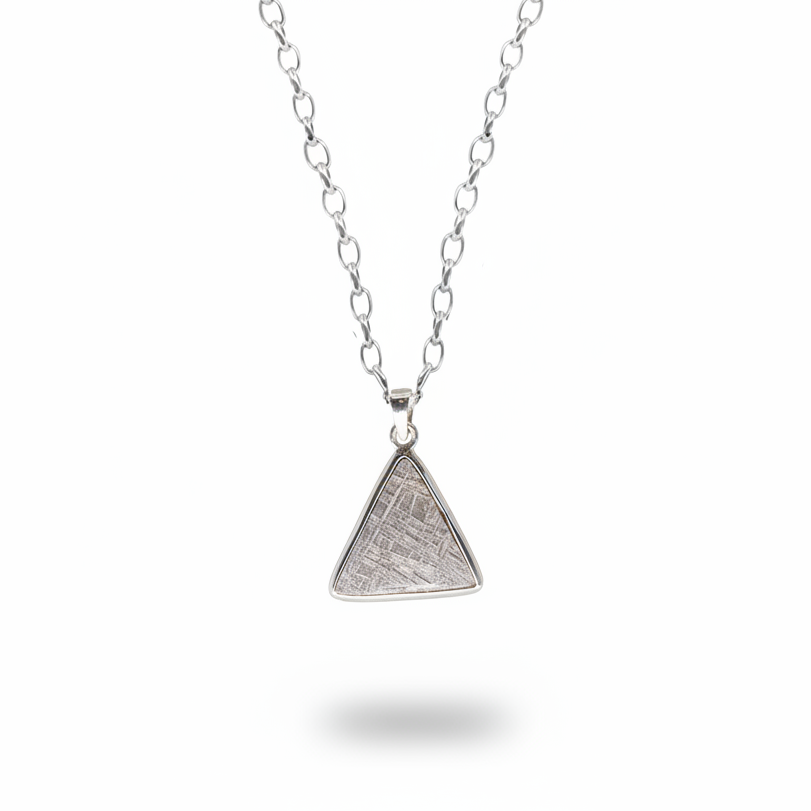 Triangular gibeon meteorite pendant with natural etched pattern in sterling silver