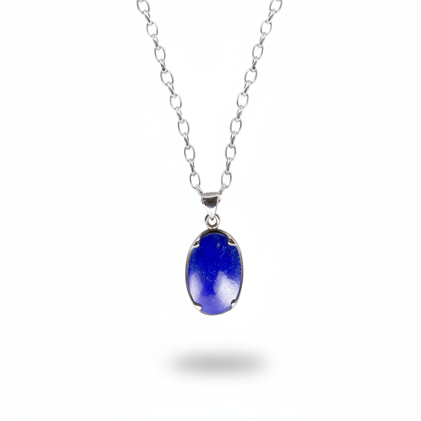 Oval lapis lazuli cabochon pendant in deep blue set in sterling silver necklace