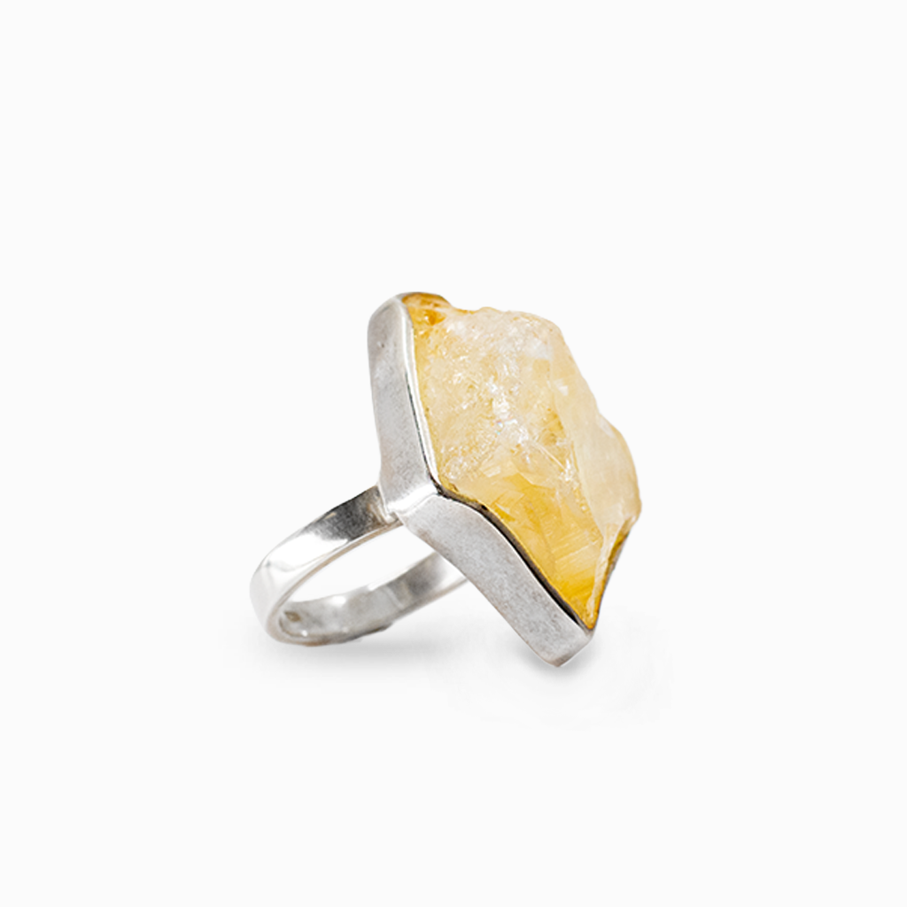 Raw golden-yellow Citrine crystal in an organic freeform sterling silver ring setting.