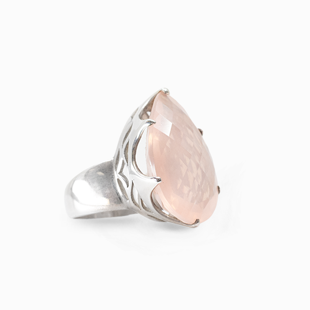 Faceted teardrop pale pink Rose Quartz gemstone held in a polished sterling silver prong setting.