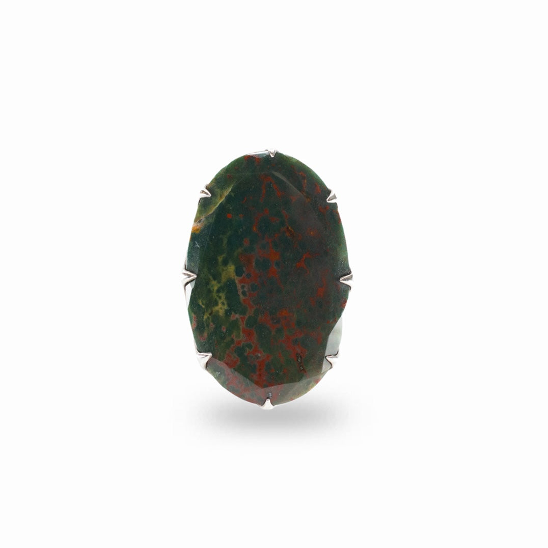 Faceted oval dark green Bloodstone with natural red markings held by sterling silver prongs.