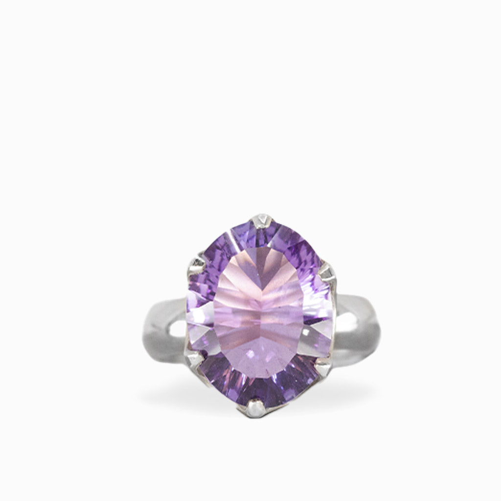 Oval faceted Amethyst ring with sparkling lavender-purple gemstone, polished sterling silver prong setting, and openwork band.