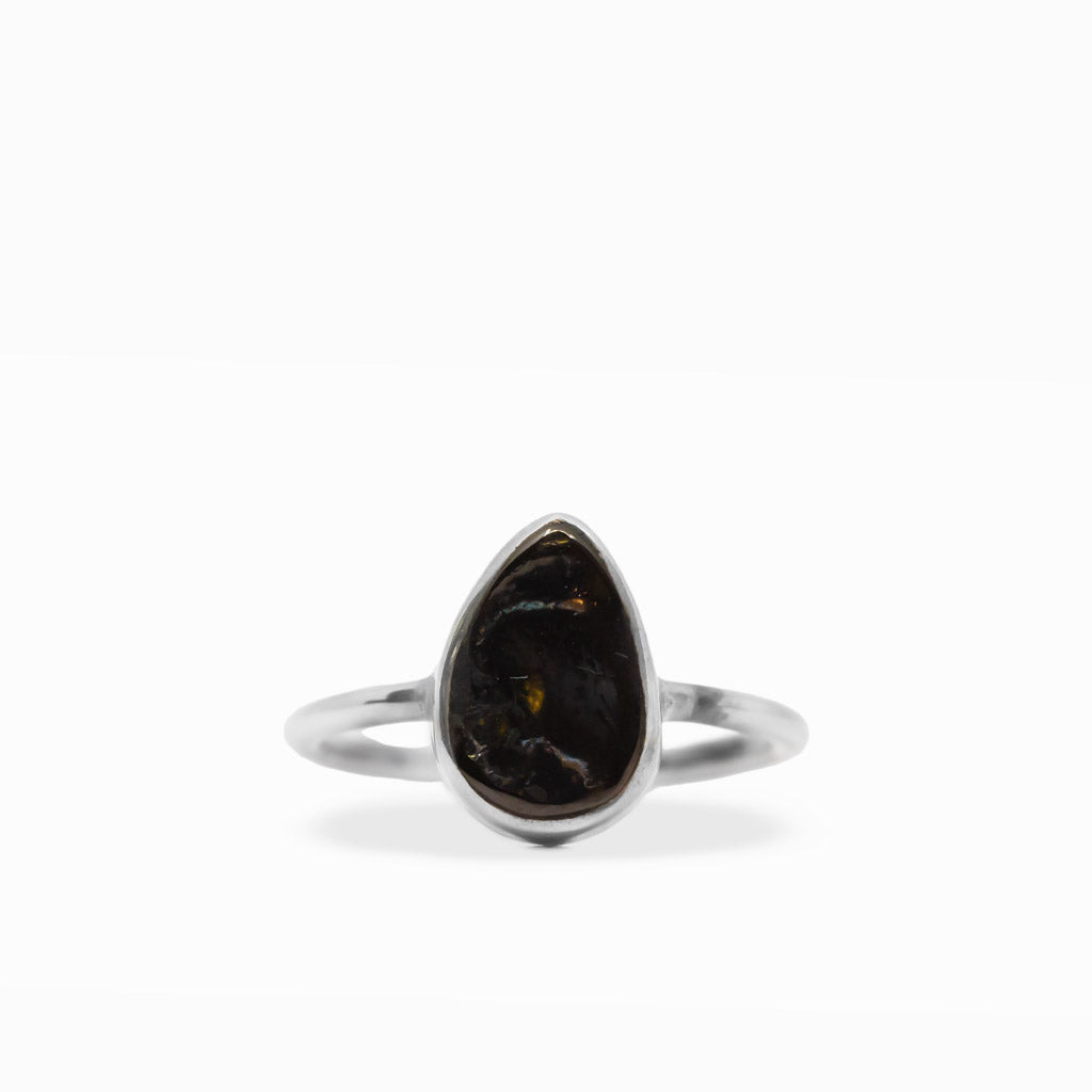 Black pear-shaped Shungite gemstone ring with polished sterling silver bezel setting and delicate split band.