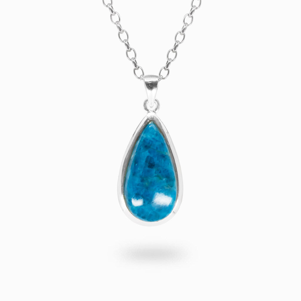 Pear-shaped bright blue Apatite cabochon pendant with natural dark blue mineral patterns in polished 925 sterling silver.