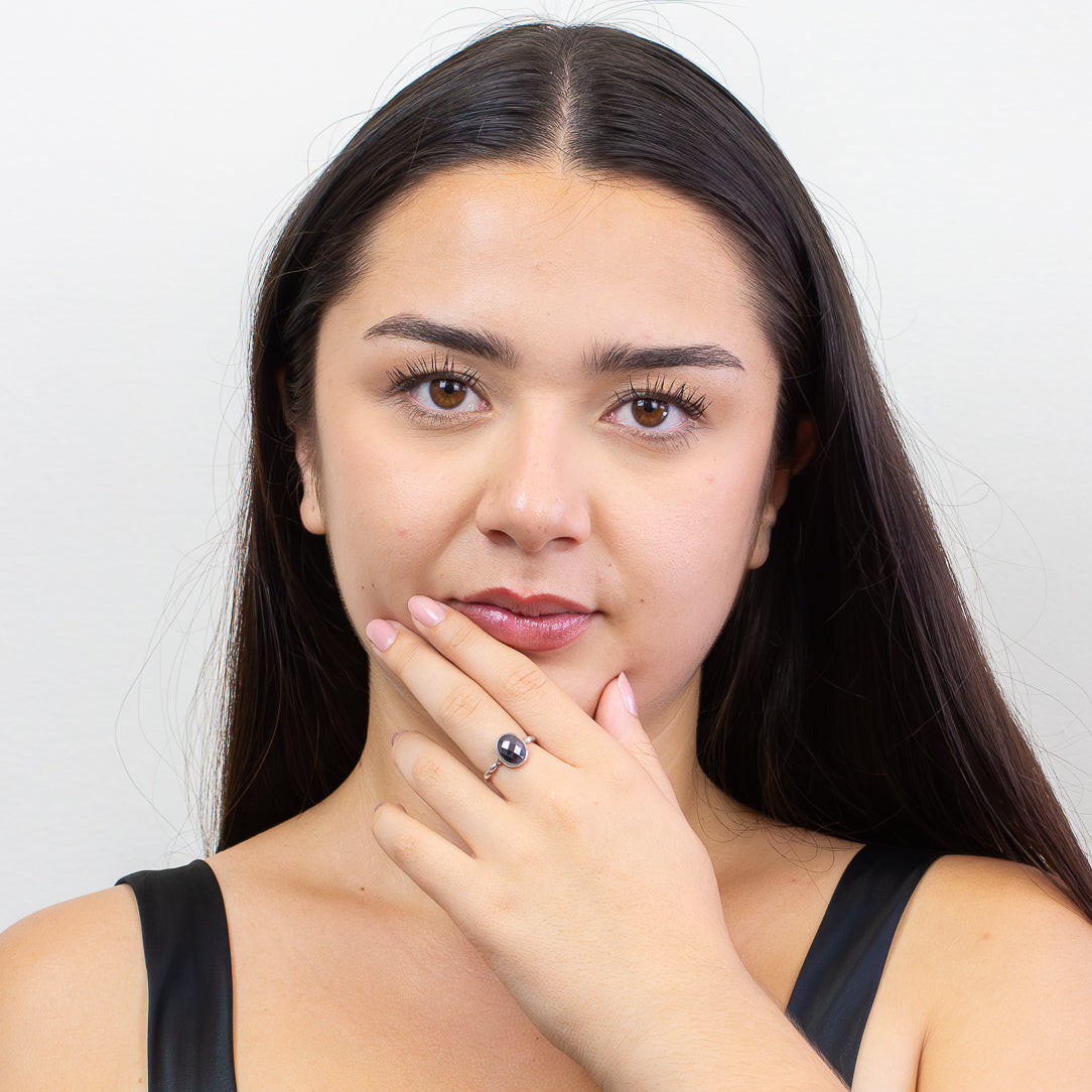 Faceted oval hematite ring with metallic black gemstone set in sterling silver