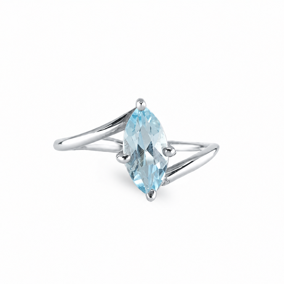 Marquise blue topaz ring with icy faceted gemstone set in sterling silver