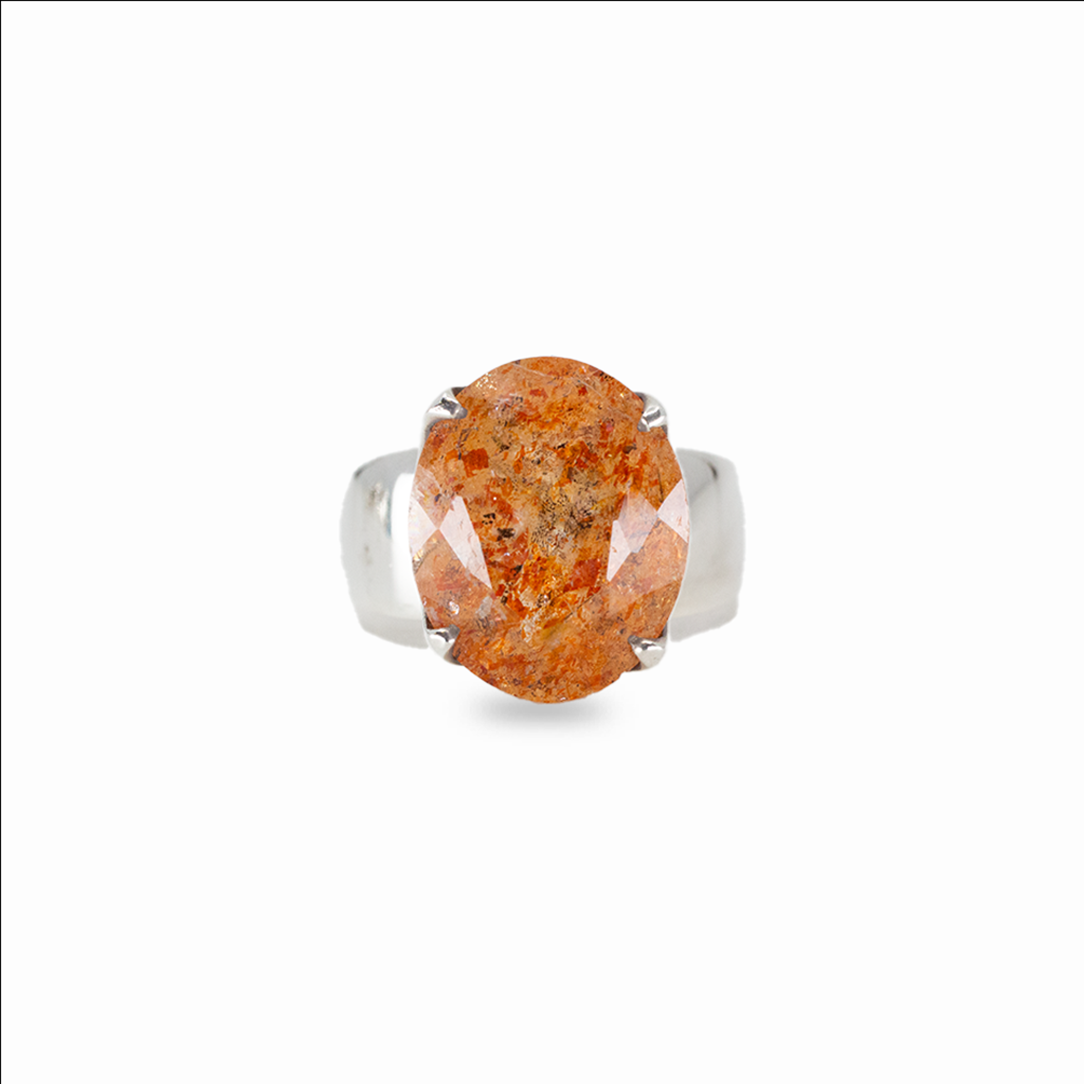Oval sunstone gemstone ring in sterling silver with warm orange tones and natural sparkling inclusions