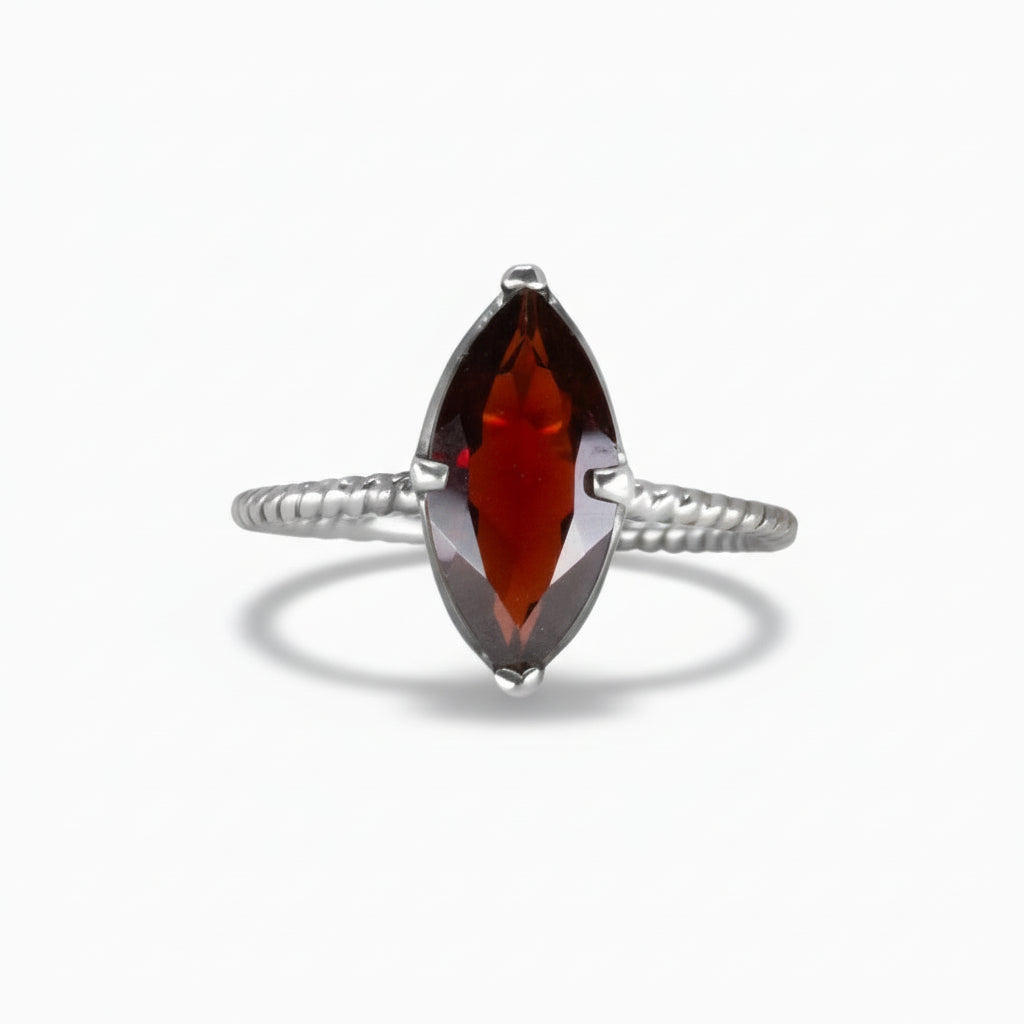 Oval polished Shungite ring set in a sterling silver textured band, featuring deep black reflective tones on a white background. | MADE IN EARTH 