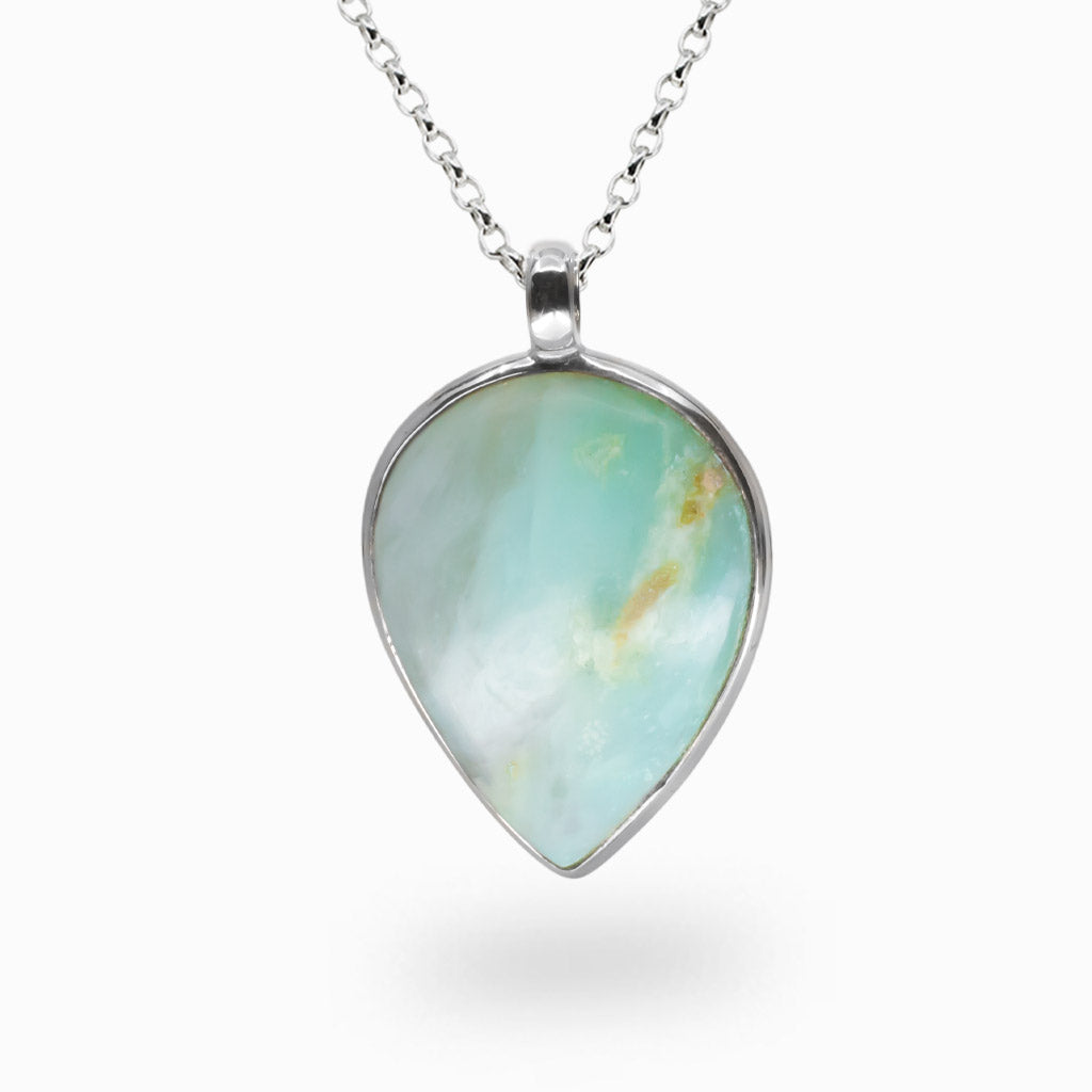 Teardrop-shaped Andean Opal pendant with soft aqua and white patterns set in sterling silver on a chain. | MADE IN EARTH