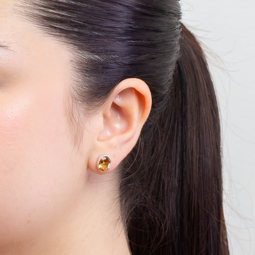 FACETED OVAL CITRINE STUD EARRINGS  ON MODEL