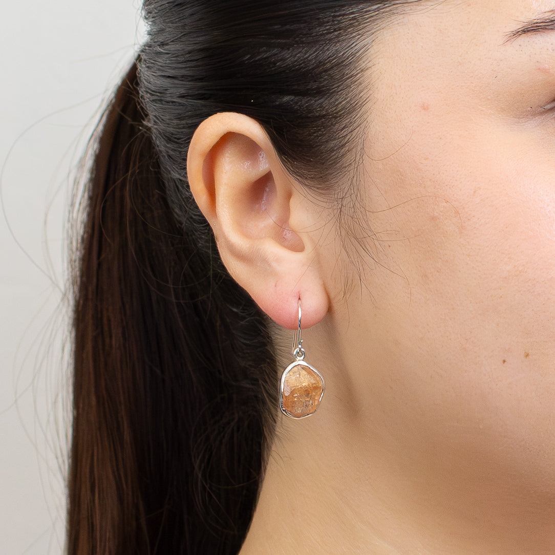 Raw Grossular Garnet earrings with golden orange natural stone set in sterling silver hooks. | MADE IN EARTH