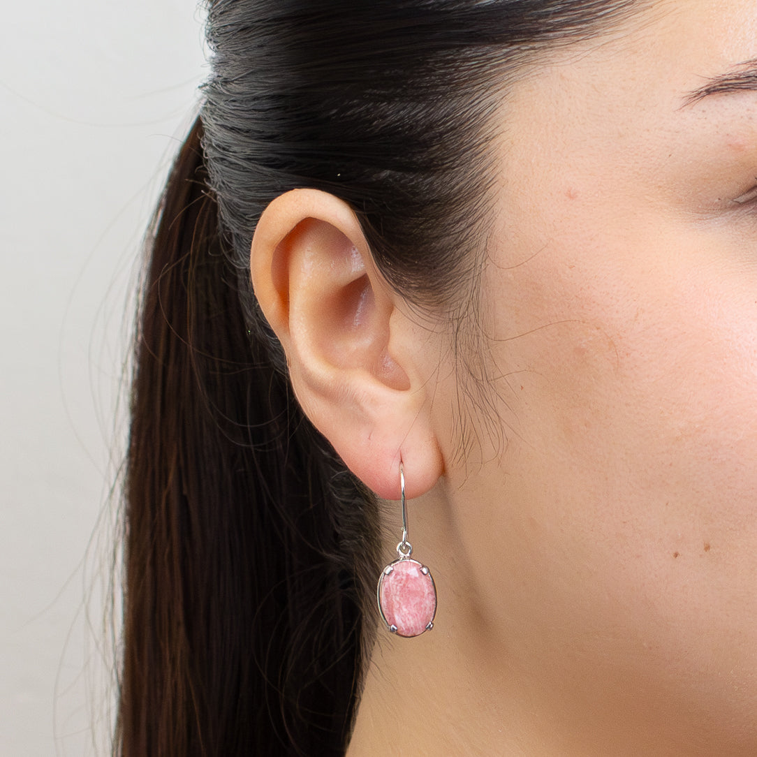 Faceted oval rhodochrosite drop earrings in sterling silver with pink and rose marbled gemstones.