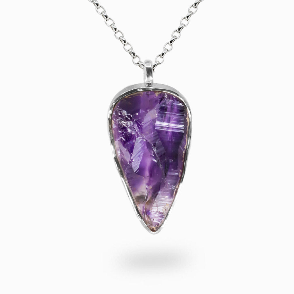 Raw purple amethyst reverse teardrop pendant necklace set in sterling silver bezel.| MADE IN EARTH