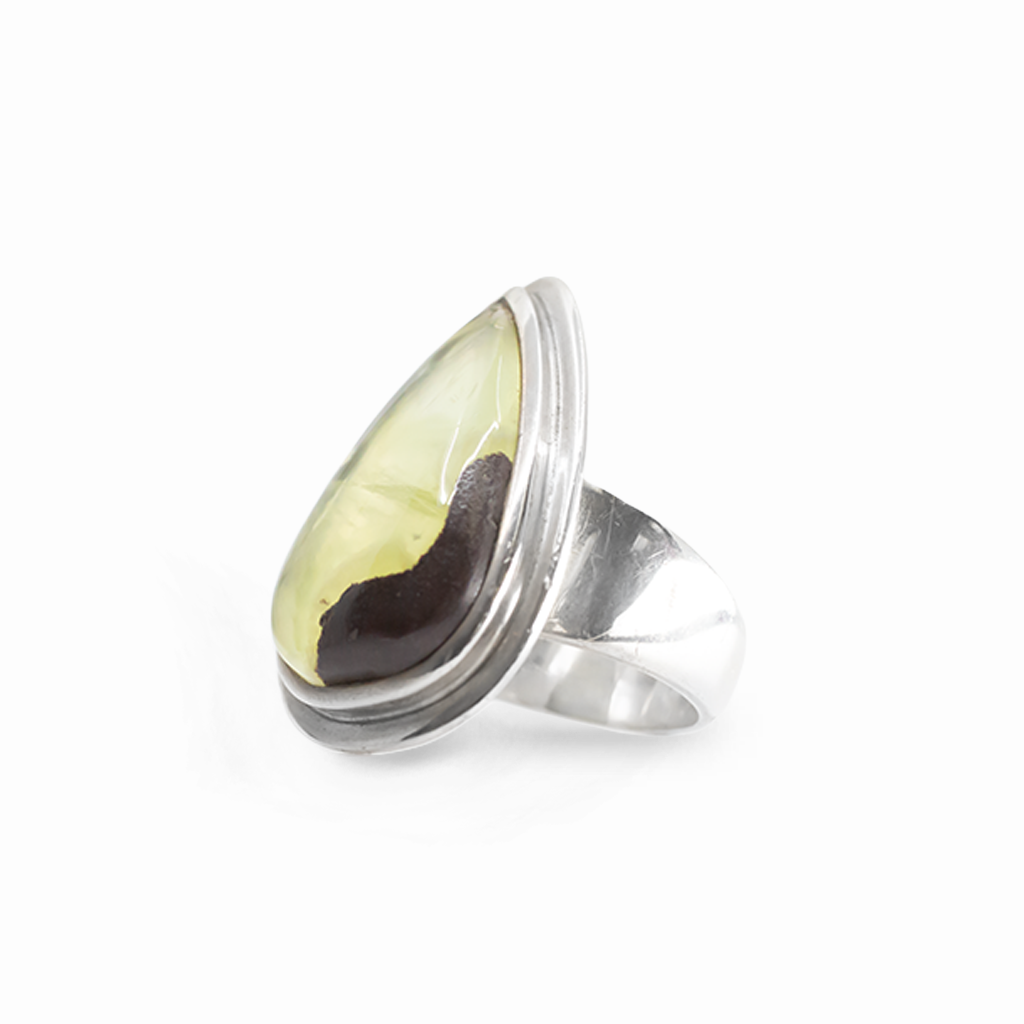 Pear-shaped yellow-green Prehnite cabochon ring with natural inclusion in polished 925 sterling silver.