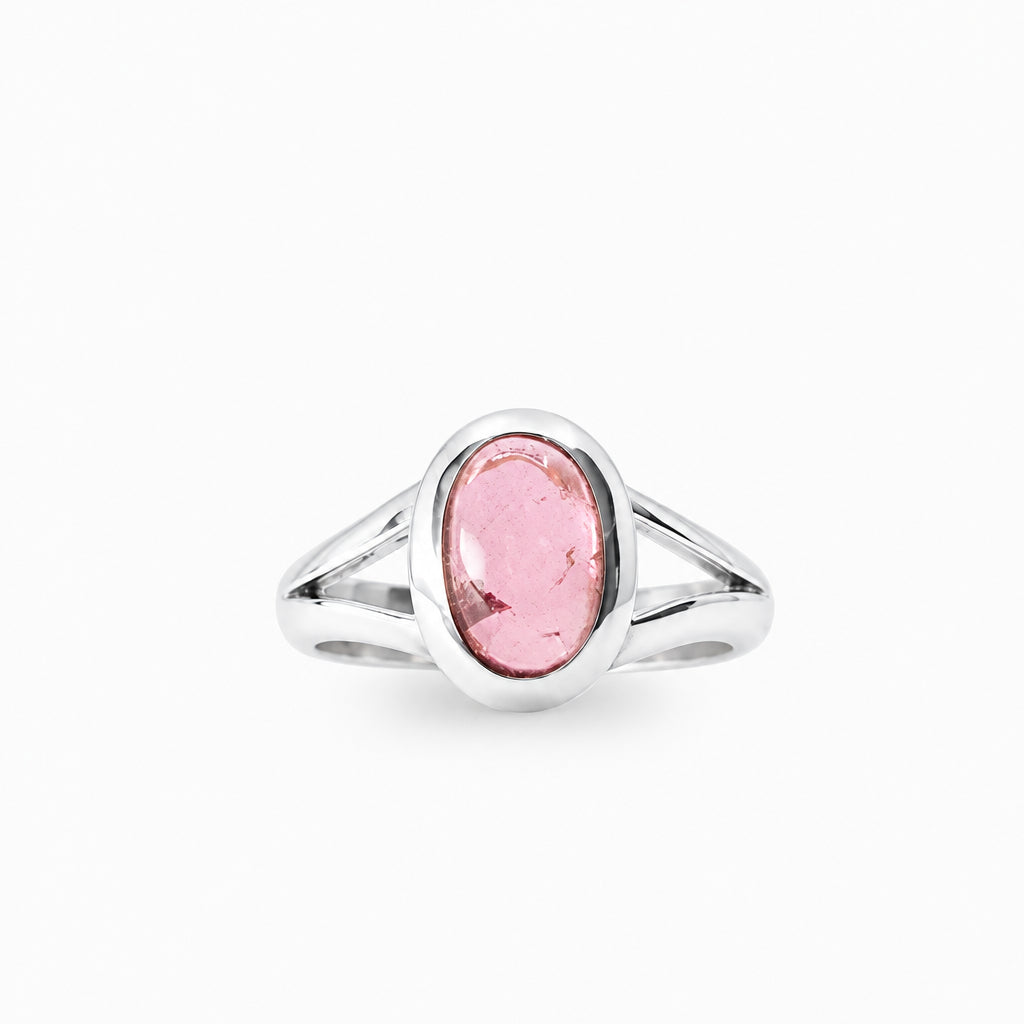 Soft pink oval Tourmaline cabochon ring in polished 925 sterling silver with a bezel setting and elegant split-shank band.