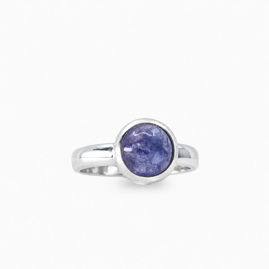 Round violet-blue Tanzanite cabochon ring in polished 925 sterling silver with a smooth bezel setting and classic band.