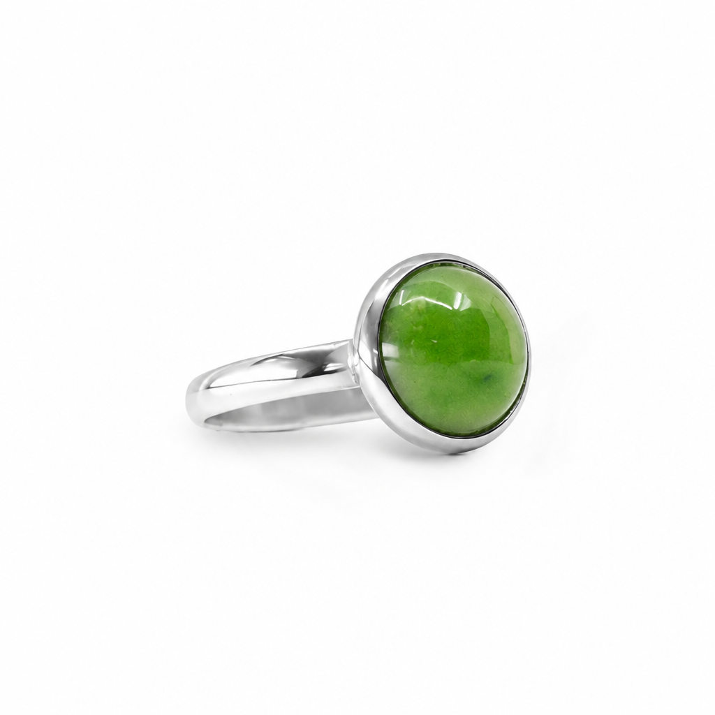 Round vibrant green Nephrite Jade cabochon ring in polished 925 sterling silver with a smooth bezel setting and classic band.