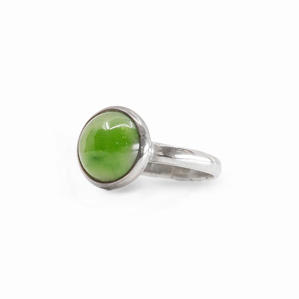 Round vibrant green Nephrite Jade cabochon ring in polished 925 sterling silver with a smooth bezel setting and classic band.