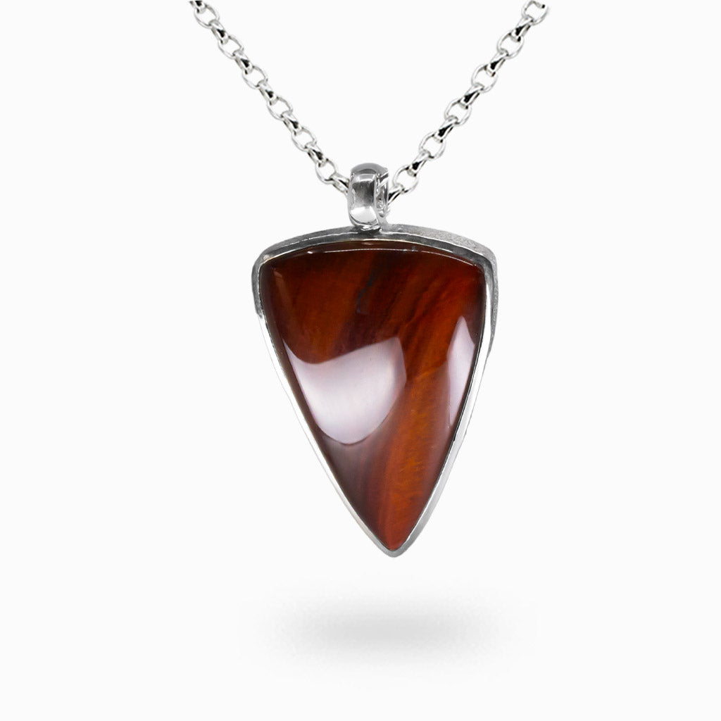 Red Tiger Eye triangle cabochon necklace in sterling silver bezel with polished chatoyant surface and rich red-brown tones
