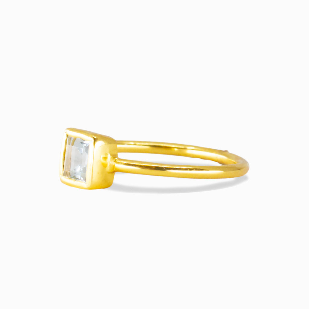 Square-cut blue topaz ring in gold vermeil with a minimalist bezel setting. | MADE IN EARTH
