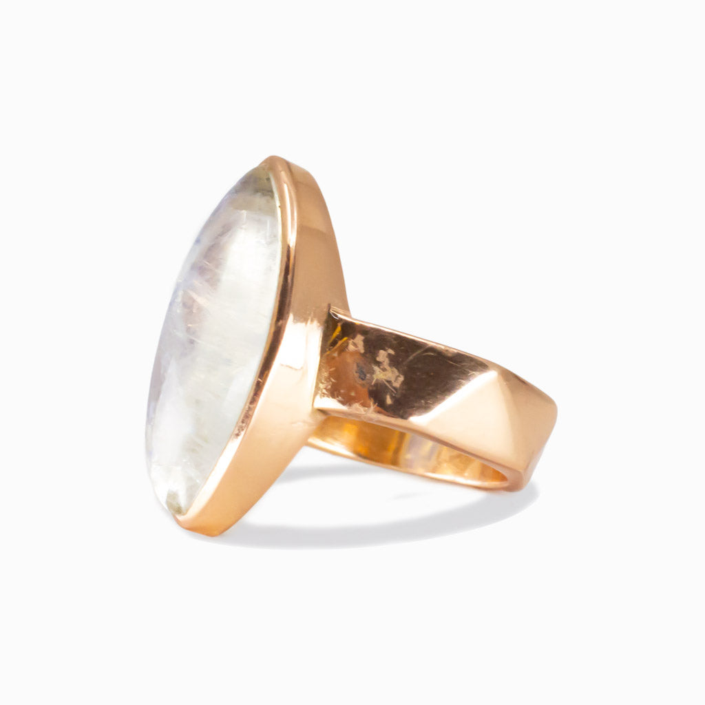 Marquise-shaped Rainbow Moonstone ring set in rose gold vermeil with a soft blue iridescent glow. | MADE IN EARTH