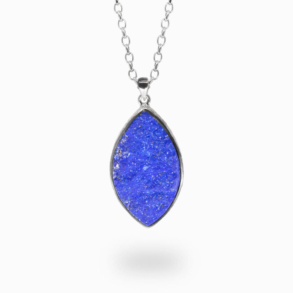 Raw marquise lapis lazuli pendant with textured sterling silver bezel and natural pyrite inclusions. | MADE IN EARTH