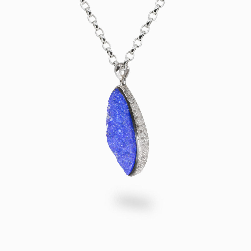 Raw marquise lapis lazuli pendant with textured sterling silver bezel and natural pyrite inclusions. | MADE IN EARTH