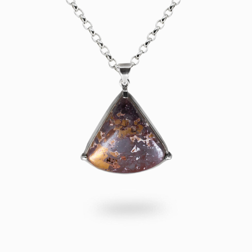 Raw copper triangle cabochon necklace in sterling silver with natural metallic texture and oxidized green highlights.