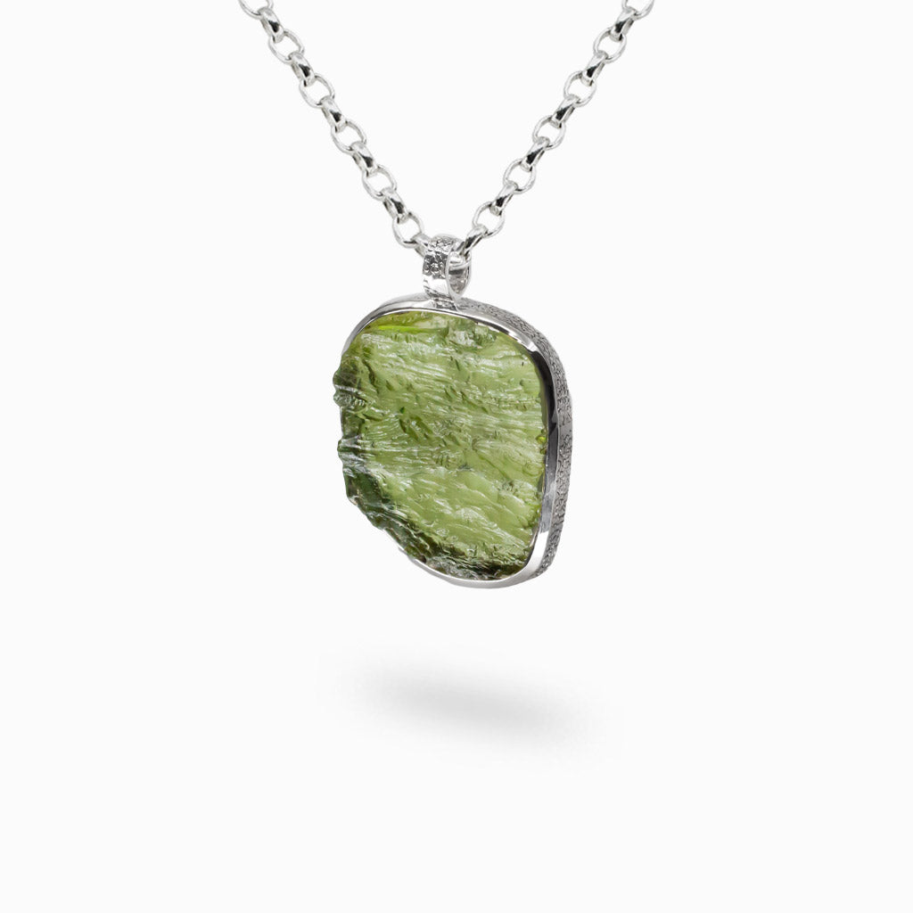 Rare raw Moldavite necklace set in sterling silver. A powerful meteorite stone known for transformation, clarity, and spiritual growth. | MADE IN EARTH