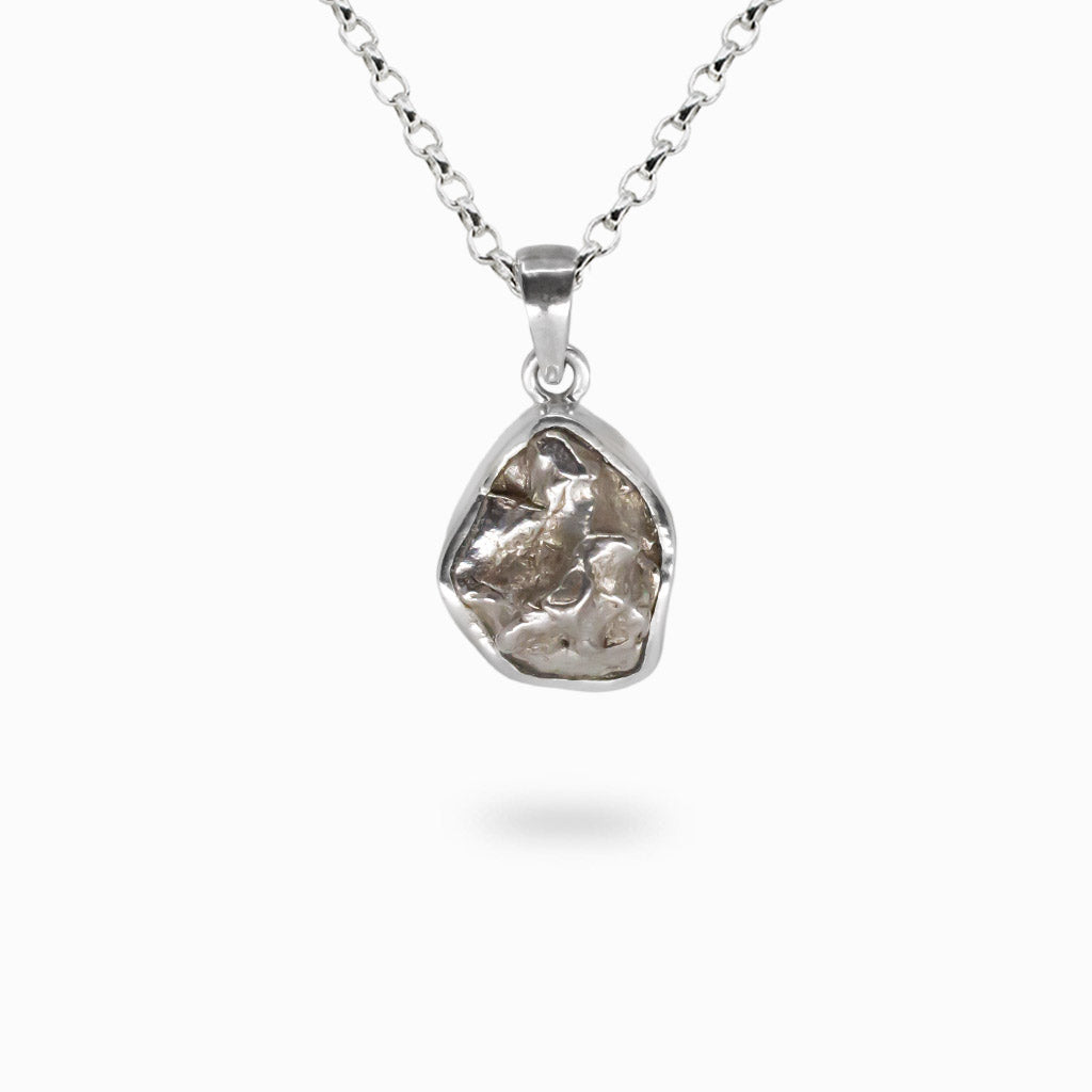 Raw Campo del Cielo meteorite necklace in sterling silver bezel with organic space stone texture. | MADE IN EARTH