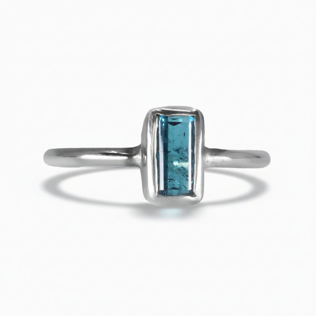 Faceted rectangle blue tourmaline ring in a silver bezel setting on a thin sterling silver band | MADE IN EARTH
