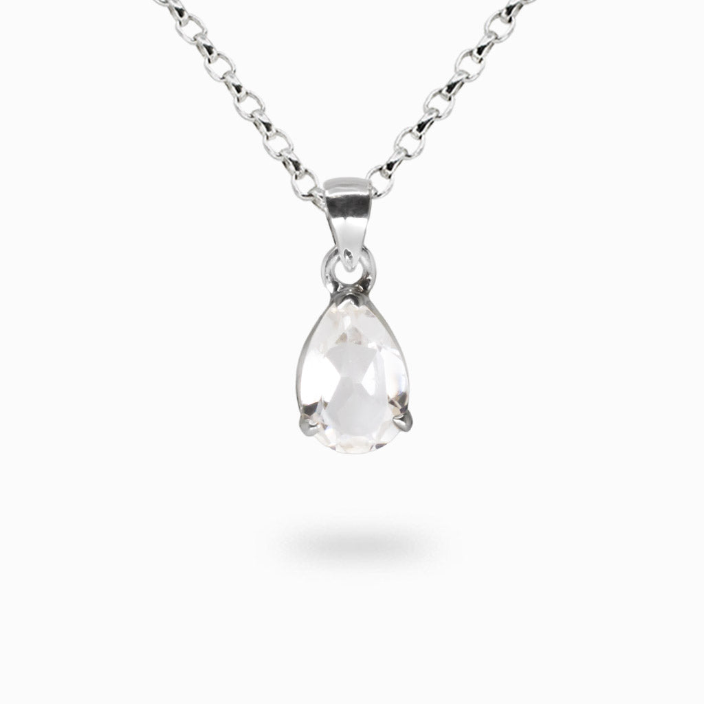 Faceted tear-shaped clear quartz gemstone pendant set in sterling silver bezel.