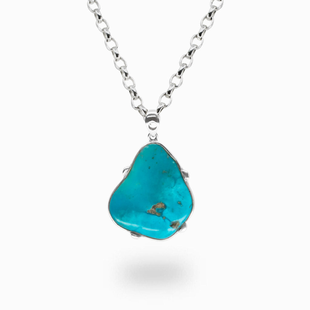 Raw Sleeping Beauty Turquoise pendant necklace in sterling silver featuring vivid sky-blue natural turquoise.