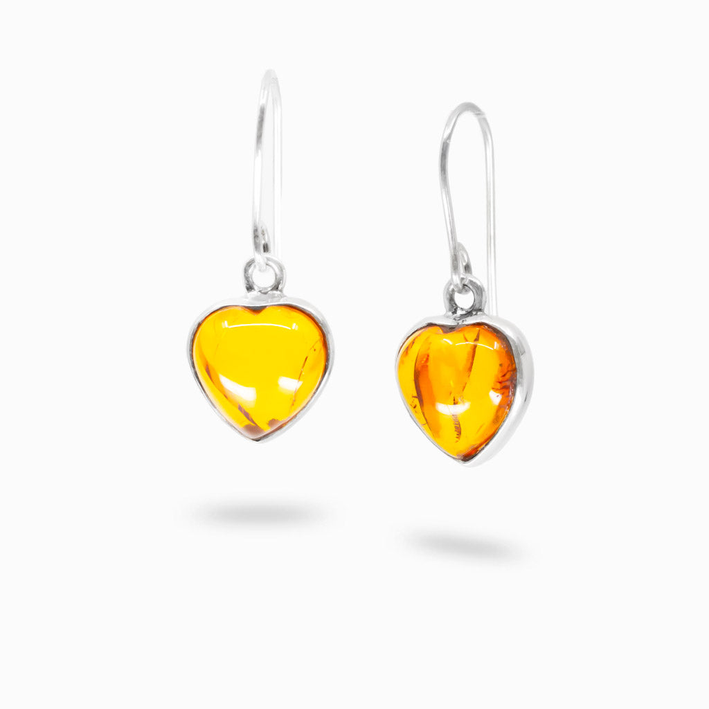 Heart shaped amber drop earrings in sterling silver