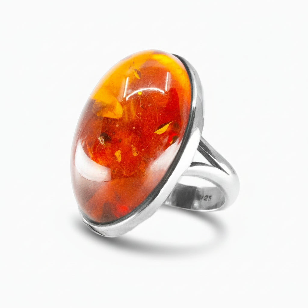 Amber cabochon ring in sterling silver featuring warm golden fossilized resin. |MADE IN EARTH