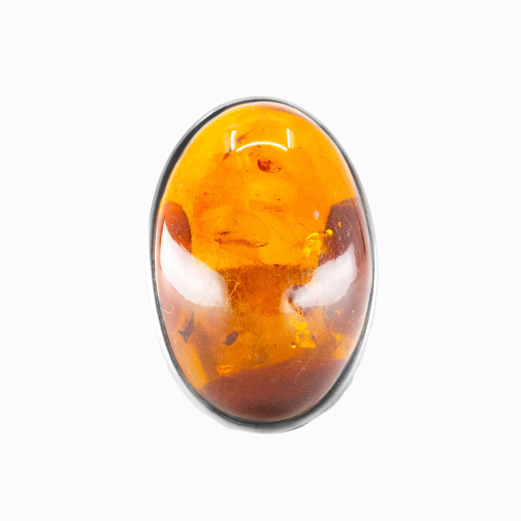 Amber cabochon ring in sterling silver featuring warm golden fossilized resin. |MADE IN EARTH