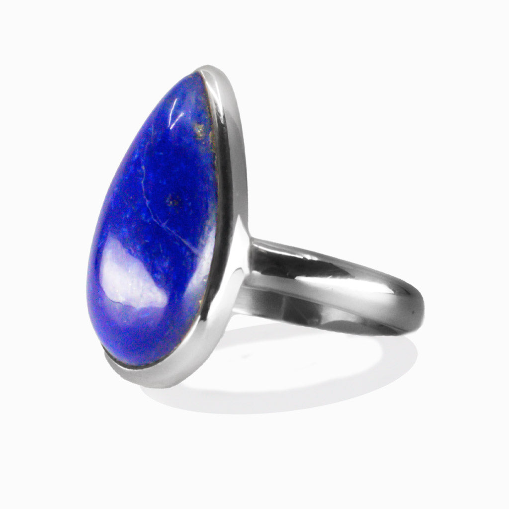 Tear shaped lapis lazuli cabochon ring set in sterling silver with deep blue gemstone and pyrite flecks. MADE IN EARTH