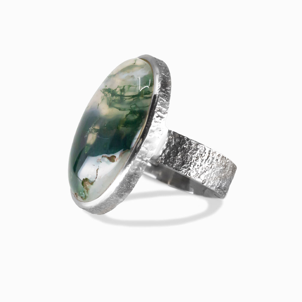 Moss Agate oval cabochon bezel ring in textured sterling silver with swirling dark green inclusions. | MADE IN EARTH 