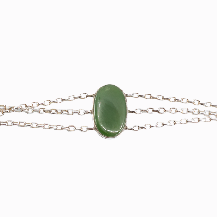 Nephrite Jade bracelet in sterling silver with polished green oval cabochon.