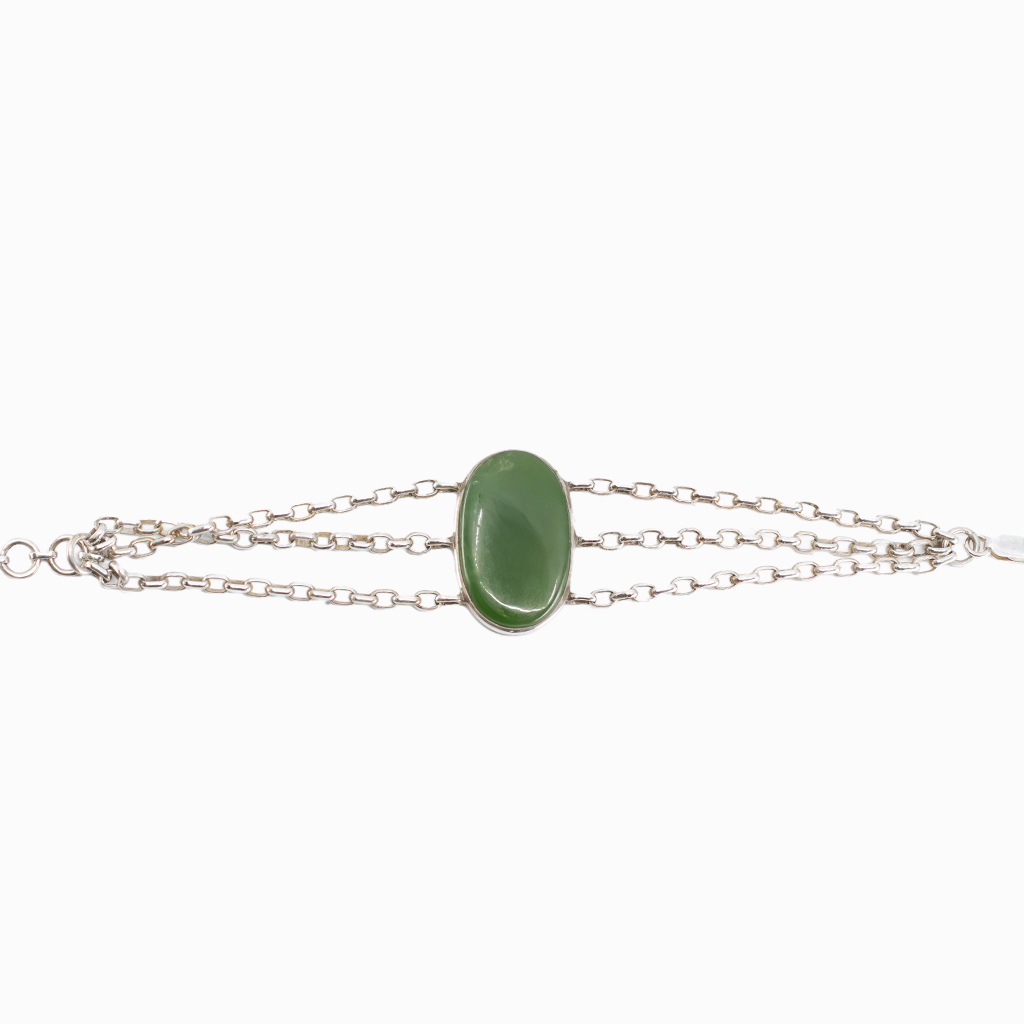 Nephrite Jade bracelet in sterling silver with polished green oval cabochon.